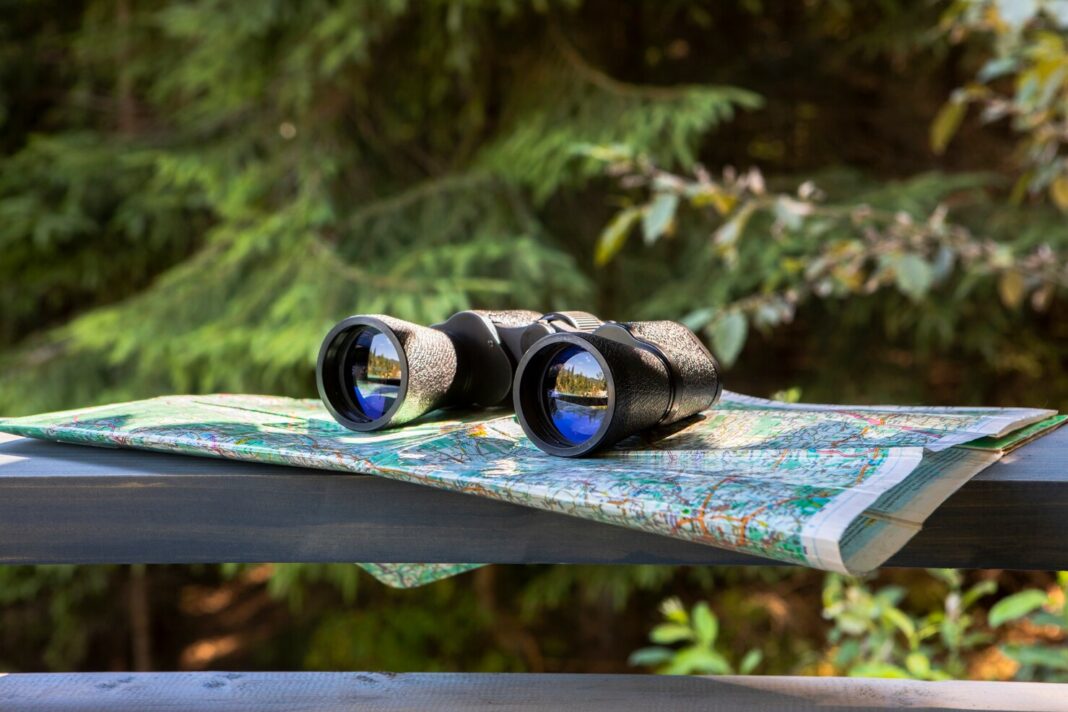 front-view-binocular-on-newspaper_23-2148300684